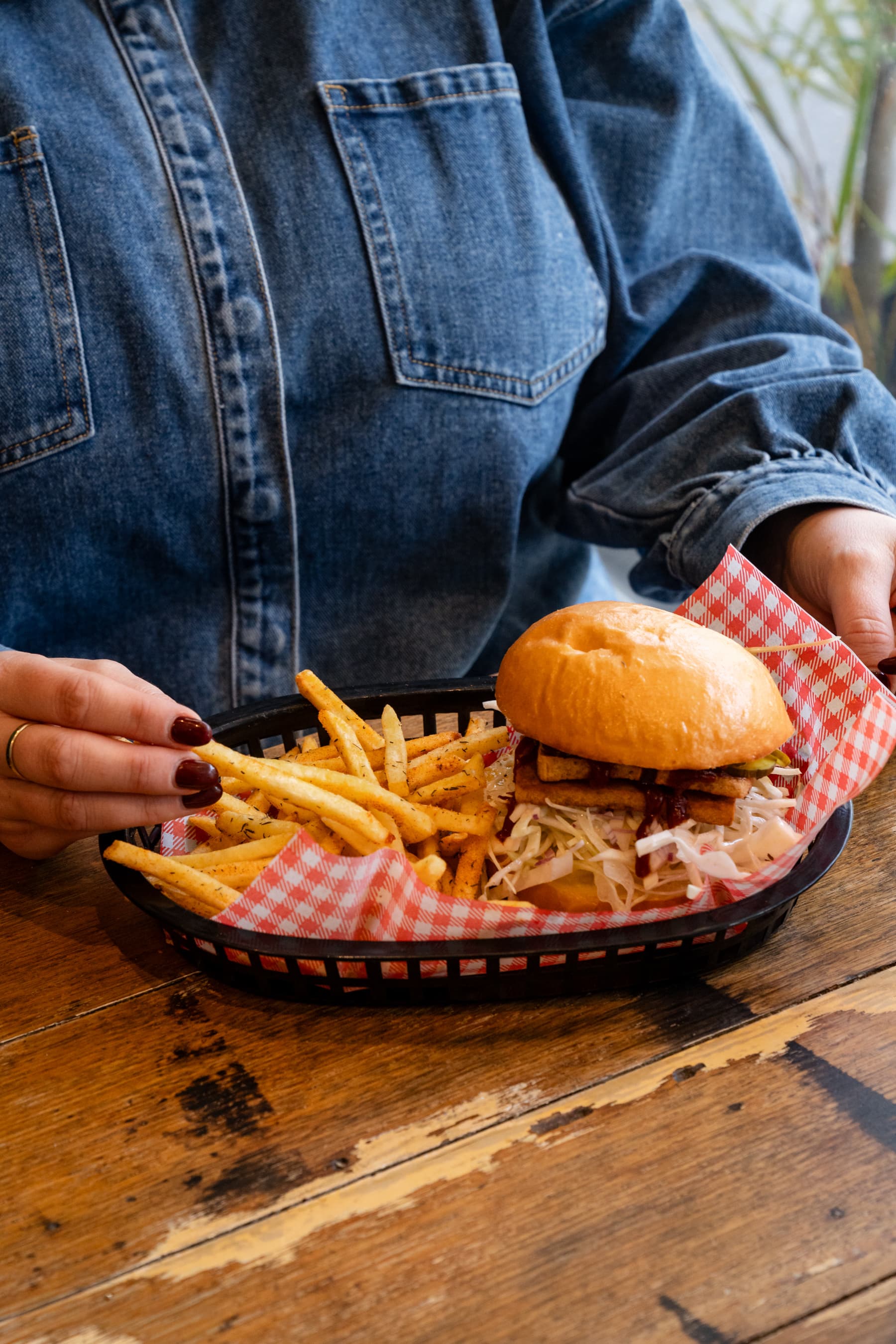 Cheeseburger and fries served in a basket