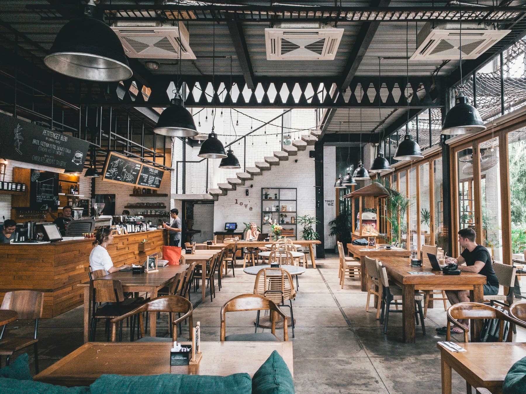 Warm local cafe storefront with outdoor seating