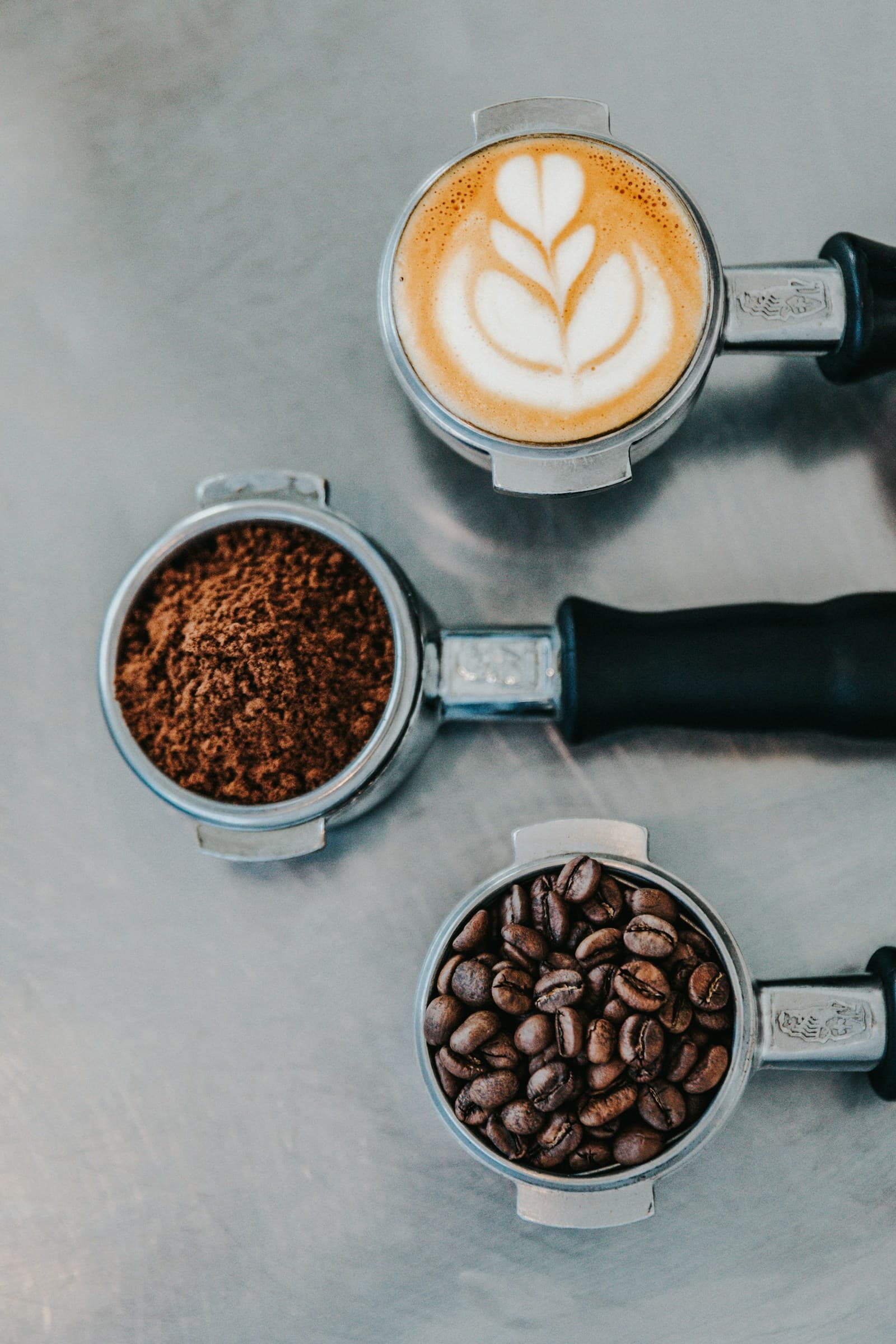 Barista pouring latte art into a cup